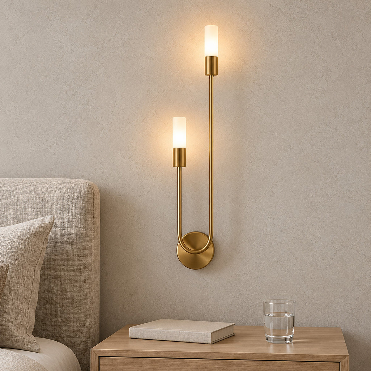 Amolven gold bedside wall light switched on in a guest sleeping alcove above a clear nightstand