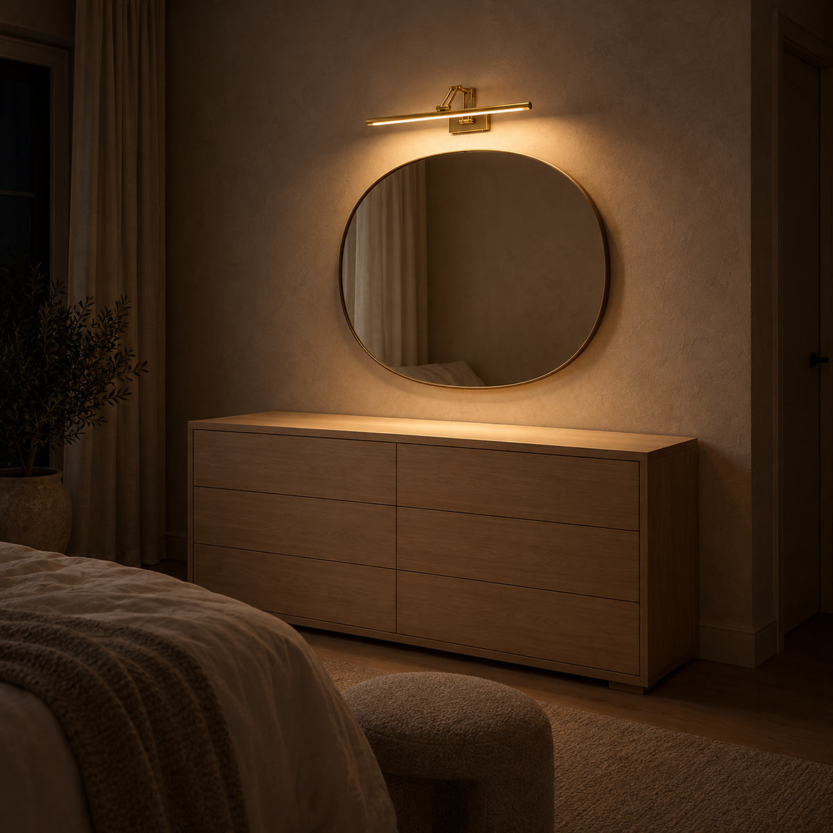 Anterilo gold rechargeable wall sconce above a bedroom mirror leaving the console clear