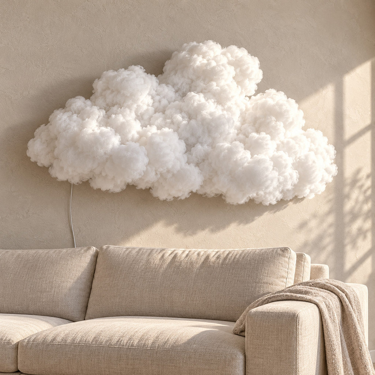 Arvimo LED cloud light in white as decor above a sunlit sofa