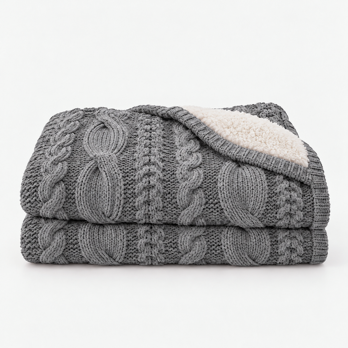 Camirel gray chunky knit blanket with a cable pattern loosely folded on a white background #color_gray
