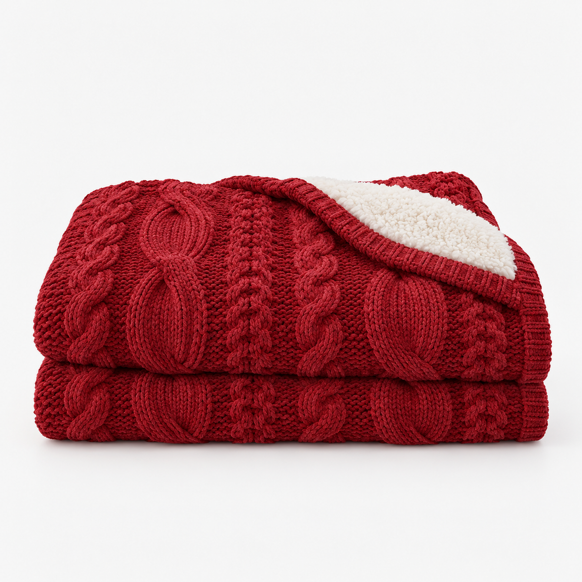 Camirel red cable knit throw blanket loosely folded on a white background