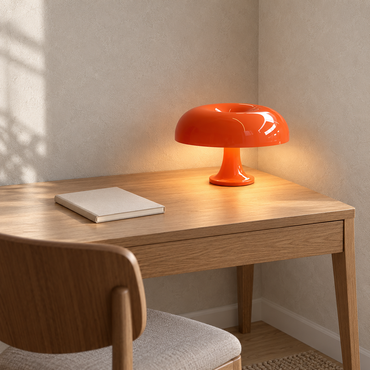 Camolire orange rechargeable table lamp lit at a tidy home office desk