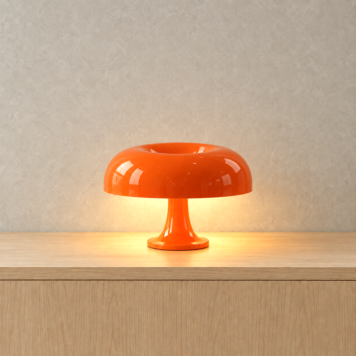 Camolire orange table lamp casting a warm glow beneath its glossy mushroom cap