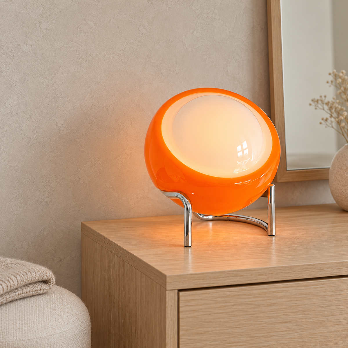 Canolva orange table lamp glowing on a dressing room dresser in daylight