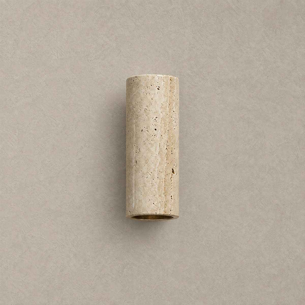 Cimorela travertine wall sconce on a walnut base, unlit against a plain plaster wall