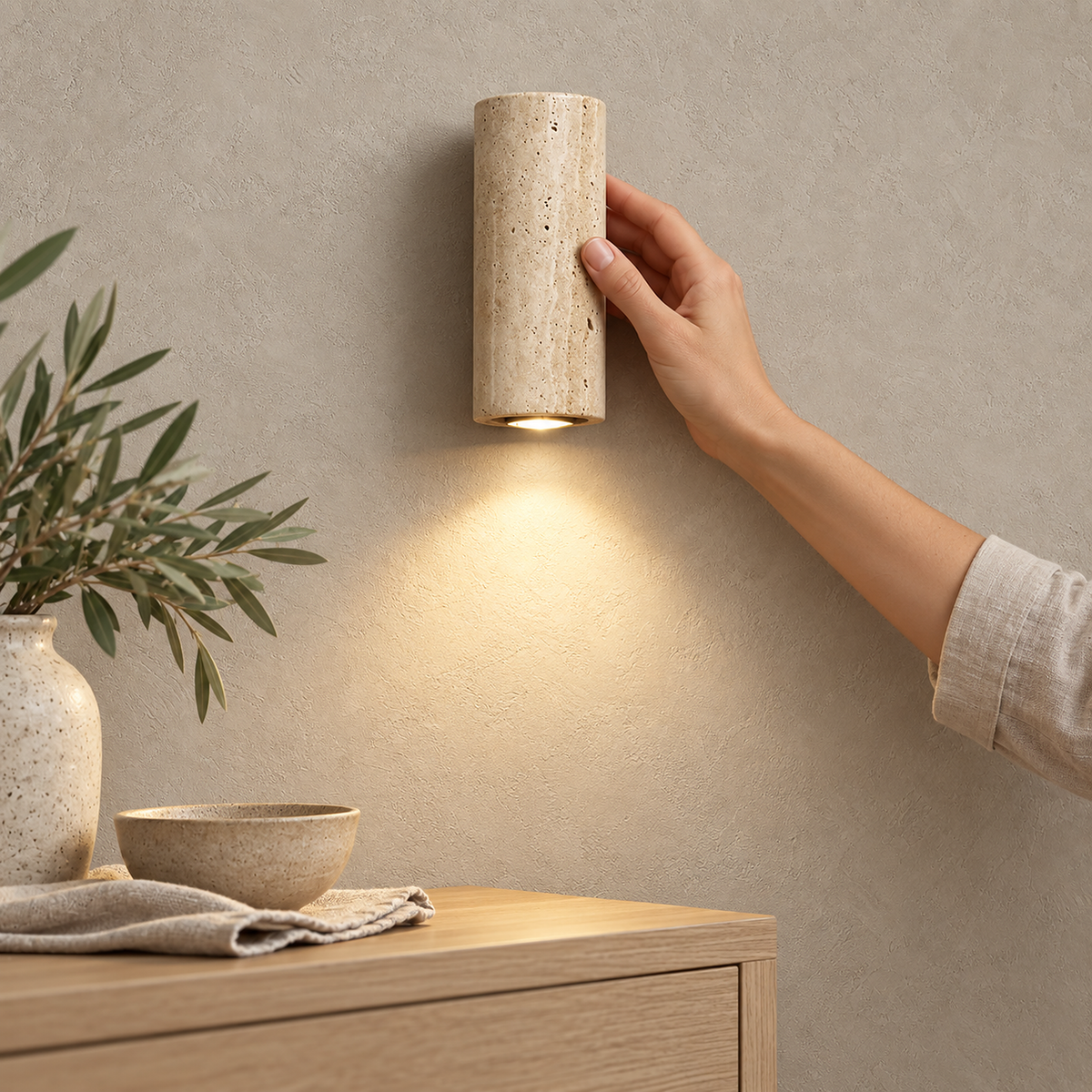Cimorela warm white wall sconce showing the lit opening at its lower end
