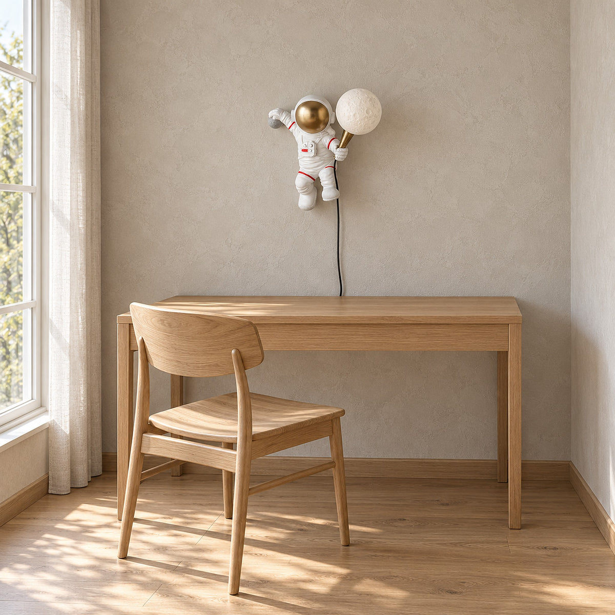 Ciremola white and gold wall lamp, unlit astronaut above a clear desk in a kids study corner