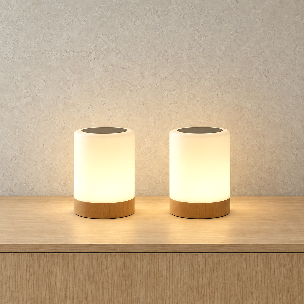 Cirmelva wood look table lamp set of two lit side by side on a plain background
