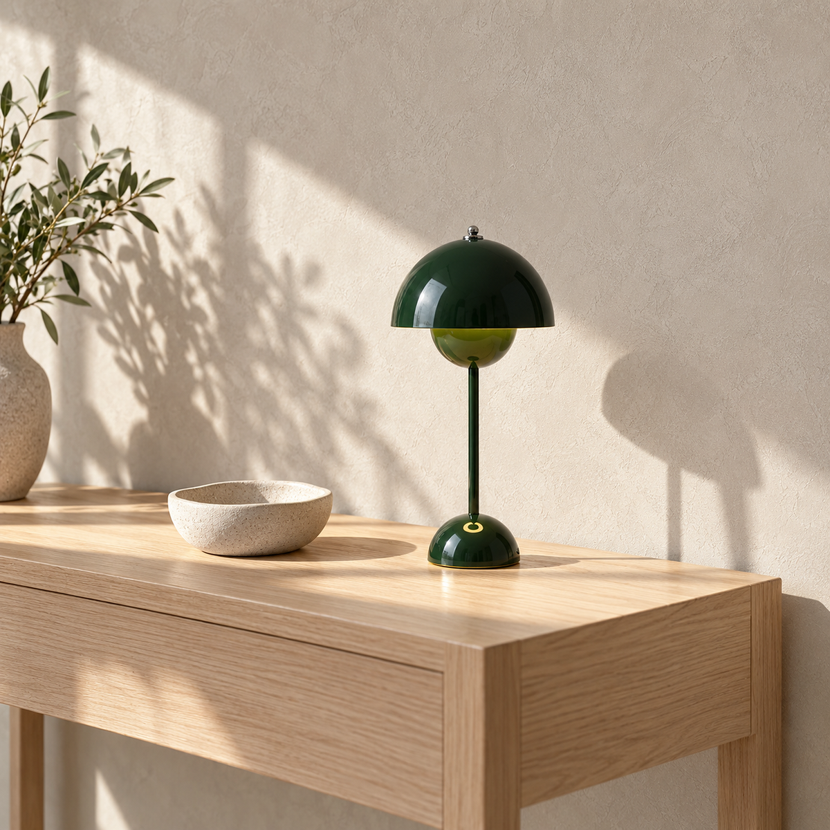 Coremila green portable table lamp standing unlit on a sunlit entryway console