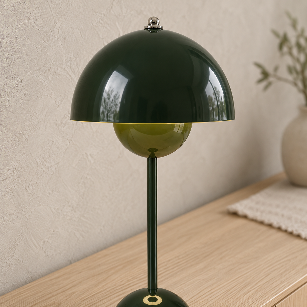 Coremila green table lamp close up showing the shade and bowl finish in a dining room