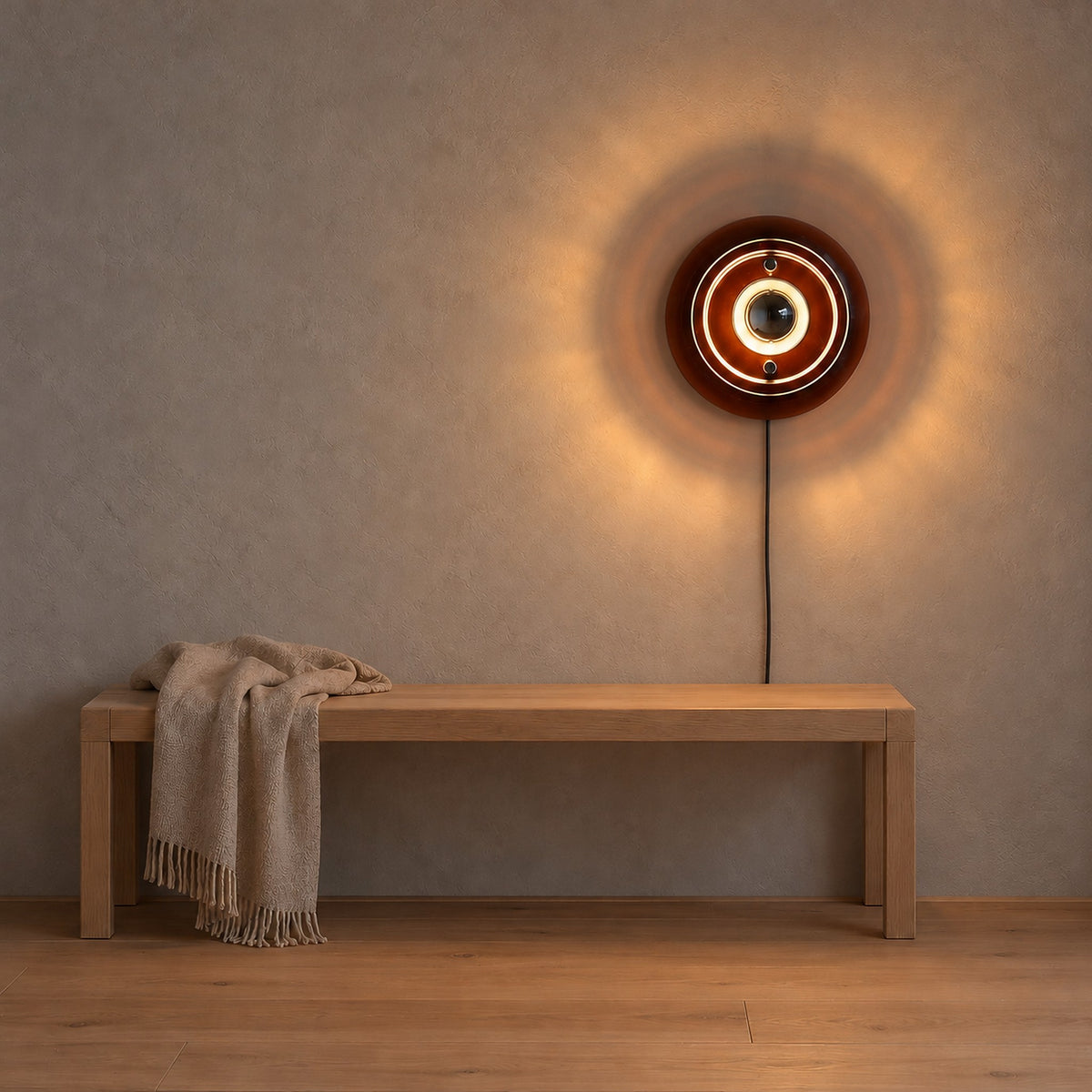 Elsarvo brown plug in wall light glowing above an entry bench in a vestibule