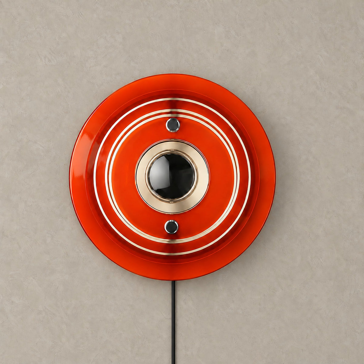 Elsarvo orange bedside wall light with unlit stepped acrylic rings on a plain backdrop #color_orange