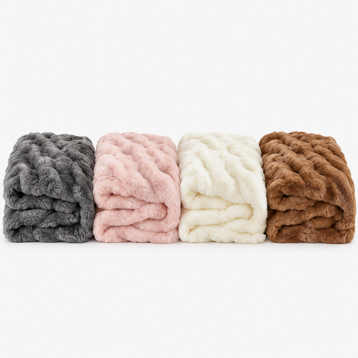 Elvasori throw blanket in gray, pink, white and caramel, folded together on a white background