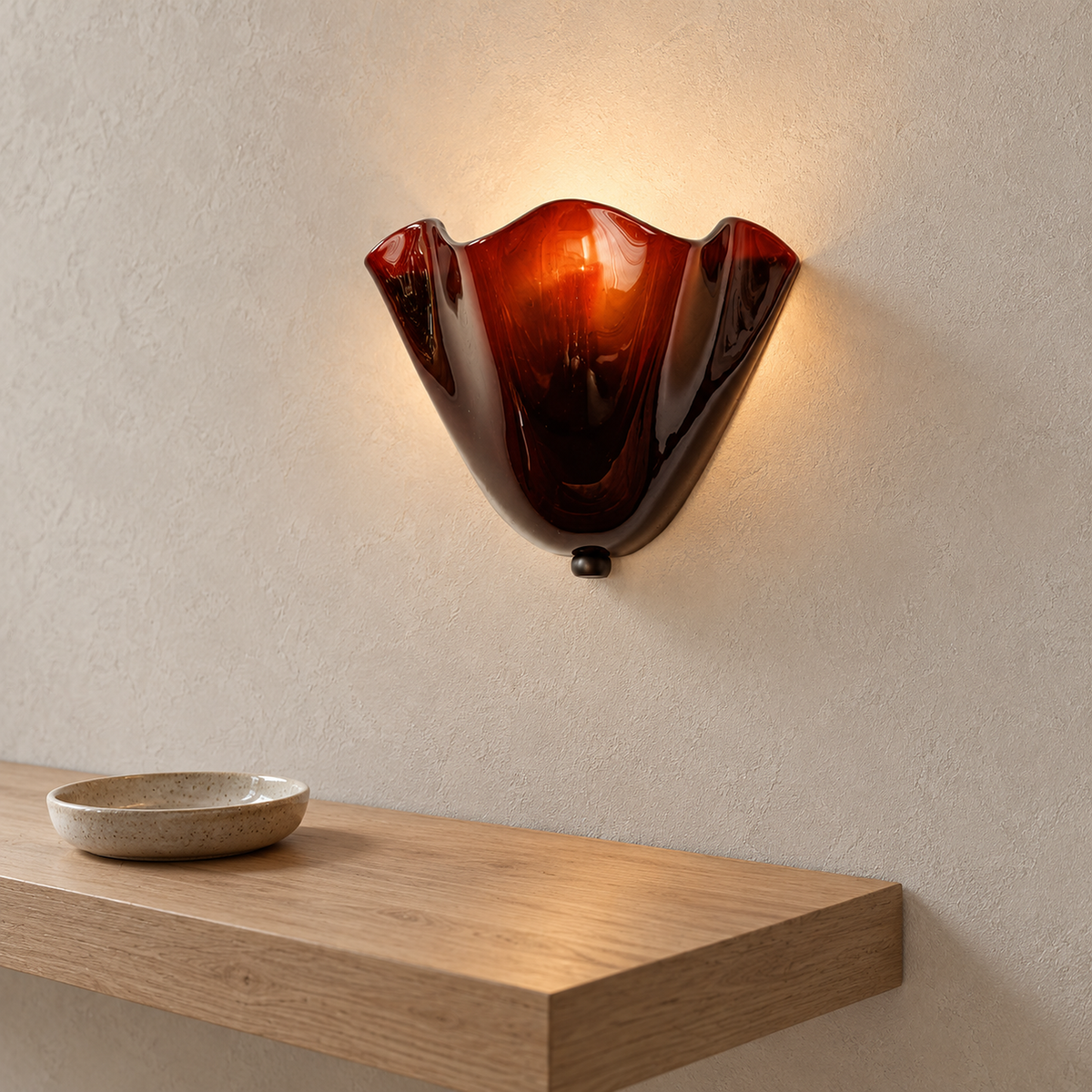 Ilsaren brown wall light mounted above a landing shelf, its glass shade lit by day #color_brown