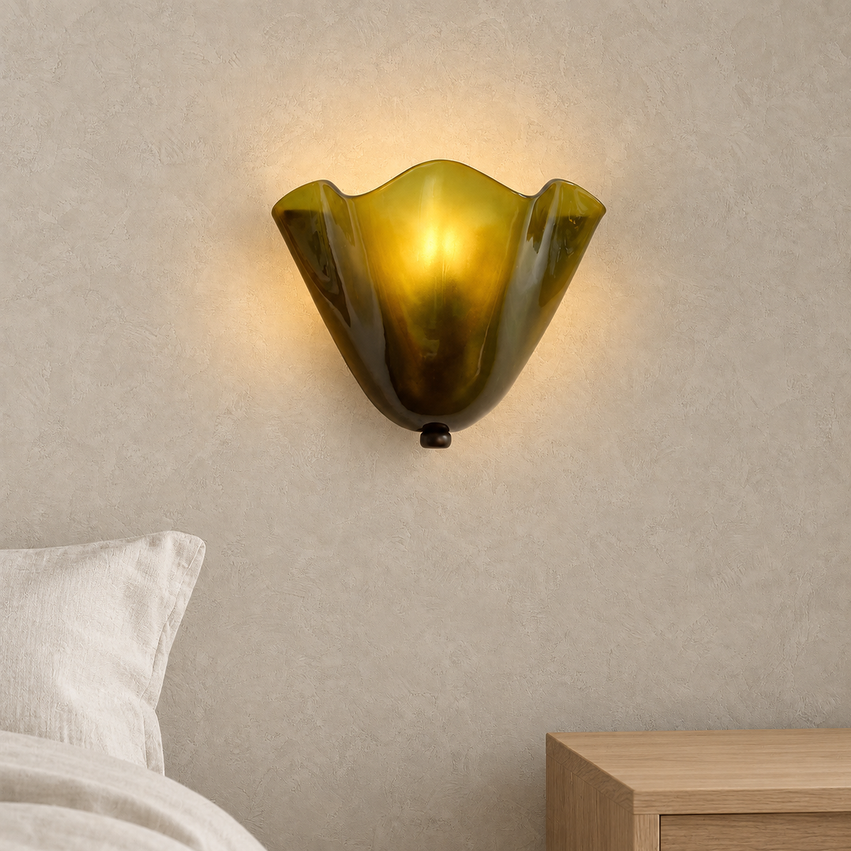 Ilsaren green plug in wall lamp glowing beside a bed in a daylit bedroom