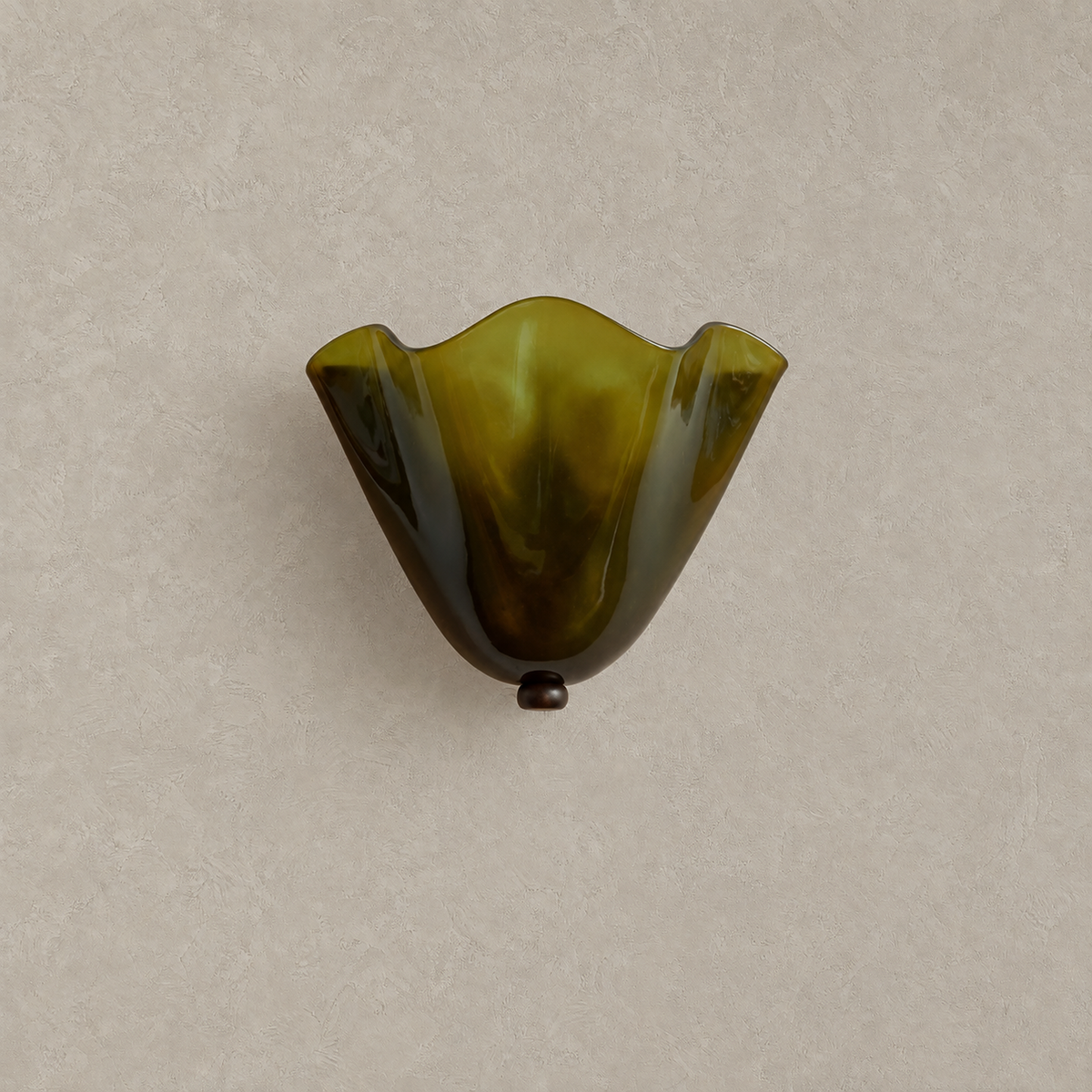 Ilsaren green plug in wall sconce with a folded glass shade, shown unlit on a plain backdrop