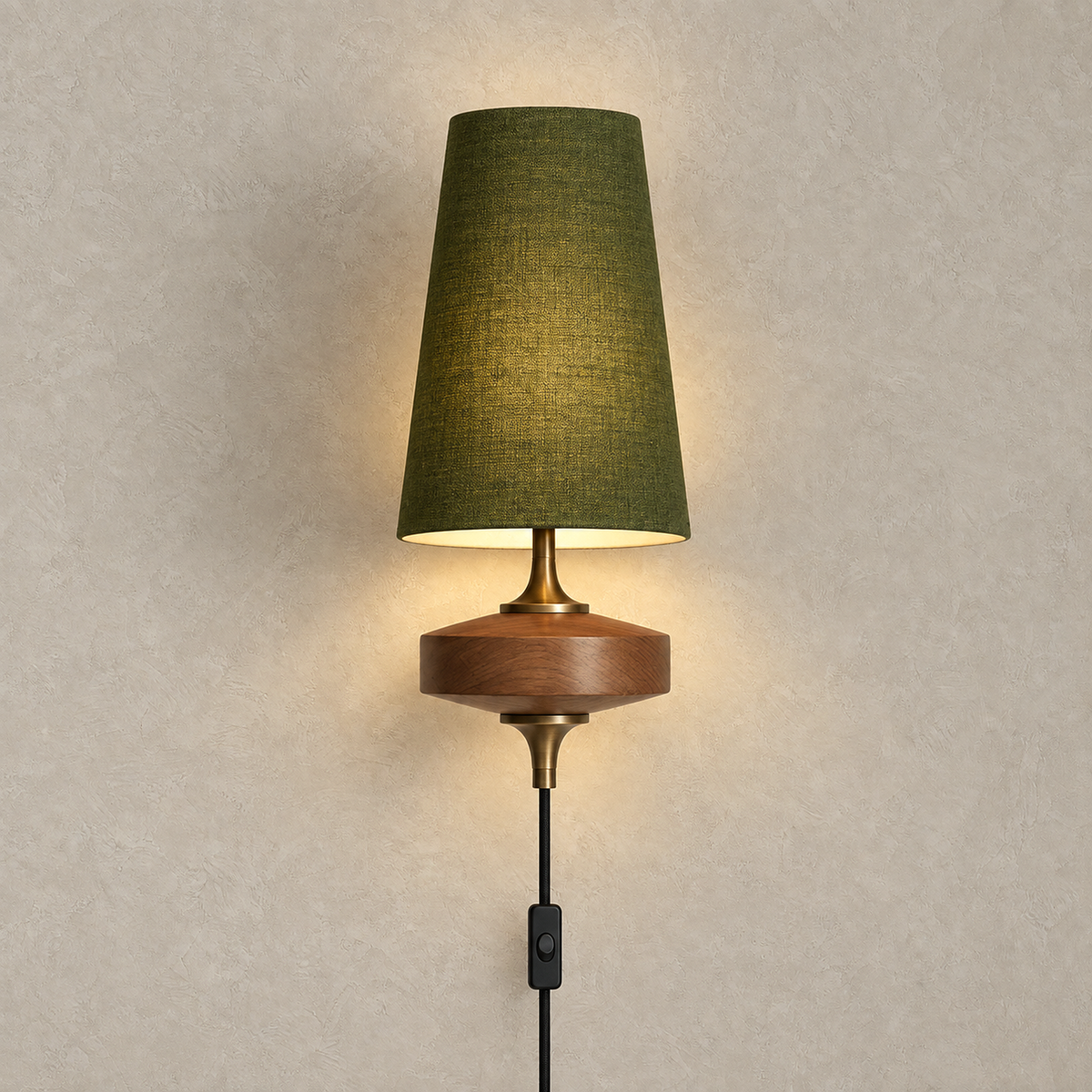 Larevio green single head wall sconce switched on against a plain plate with one fabric shade #color_green