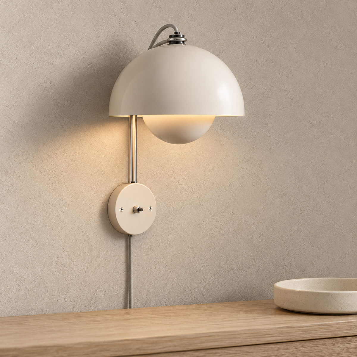 Lasorme cream wall lamp glowing warm white above an entryway console in daylight