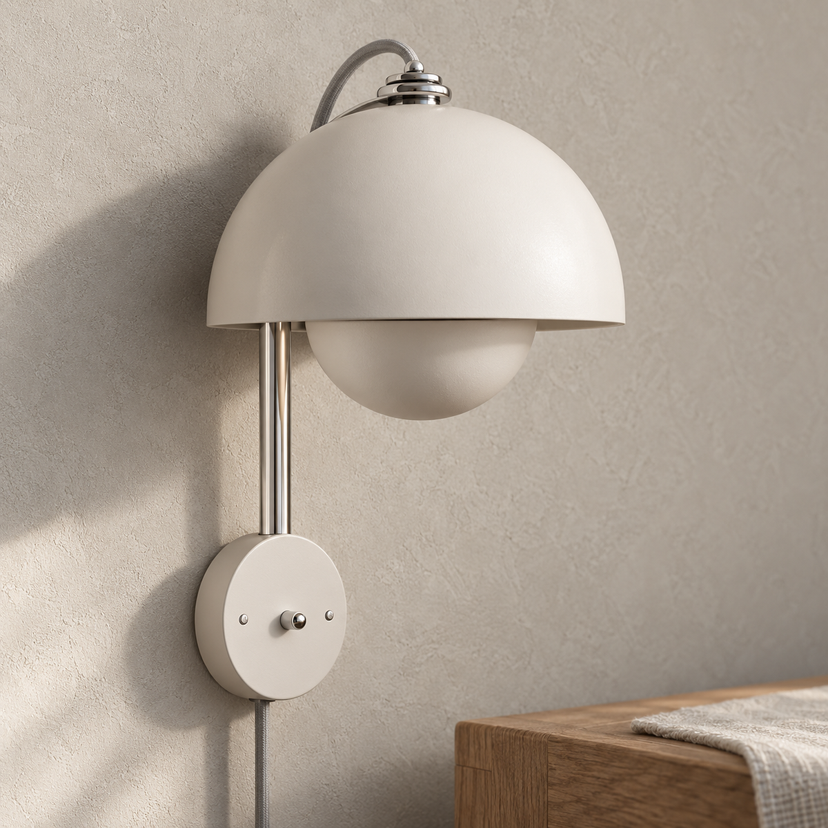 Lasorme cream led wall sconce in a close up of the painted dome and lower shade in a dining room