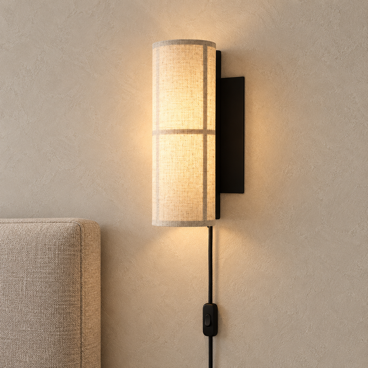 Lassivor white plug in wall lamp glowing beside an oatmeal headboard in a daylit bedroom