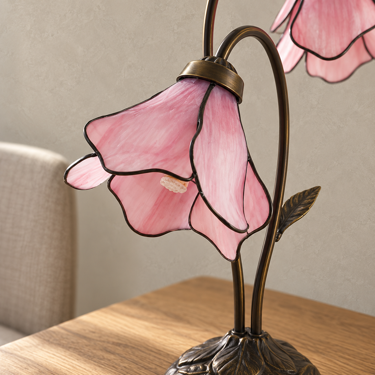 Linavor pink bedside lamp close up of the glass flower shade showing petal panels and soldered seams