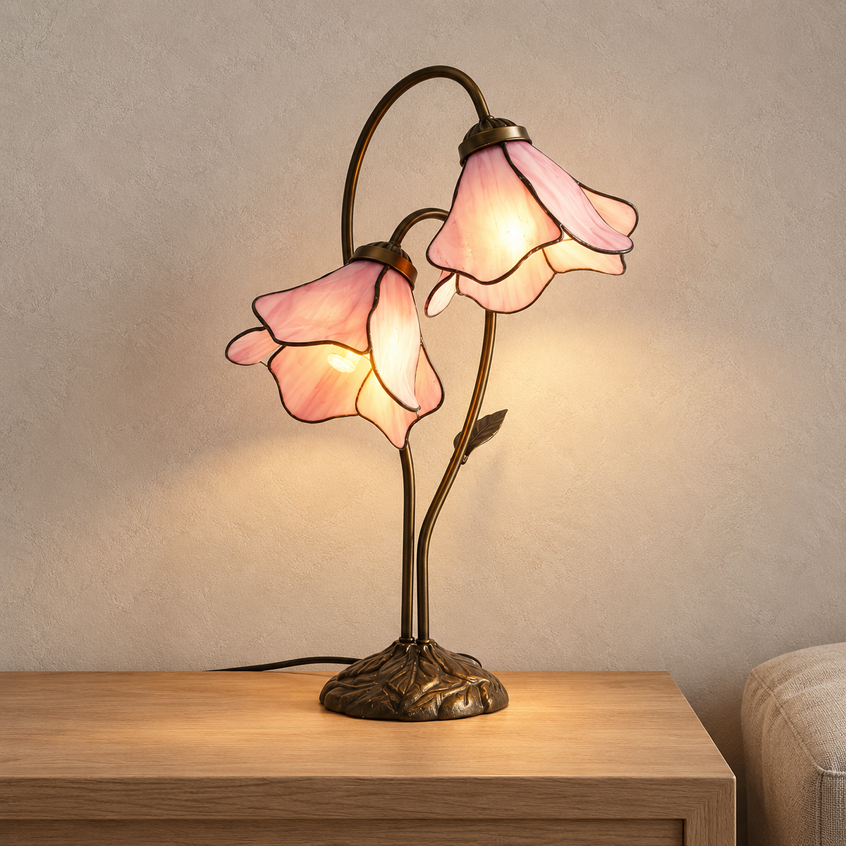 Linavor pink table lamp glowing on a console in a bright entryway during the day