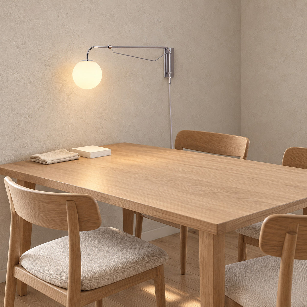 Lirelso chrome and white plug in wall light pivoted aside from daytime craft work in a dining room nook