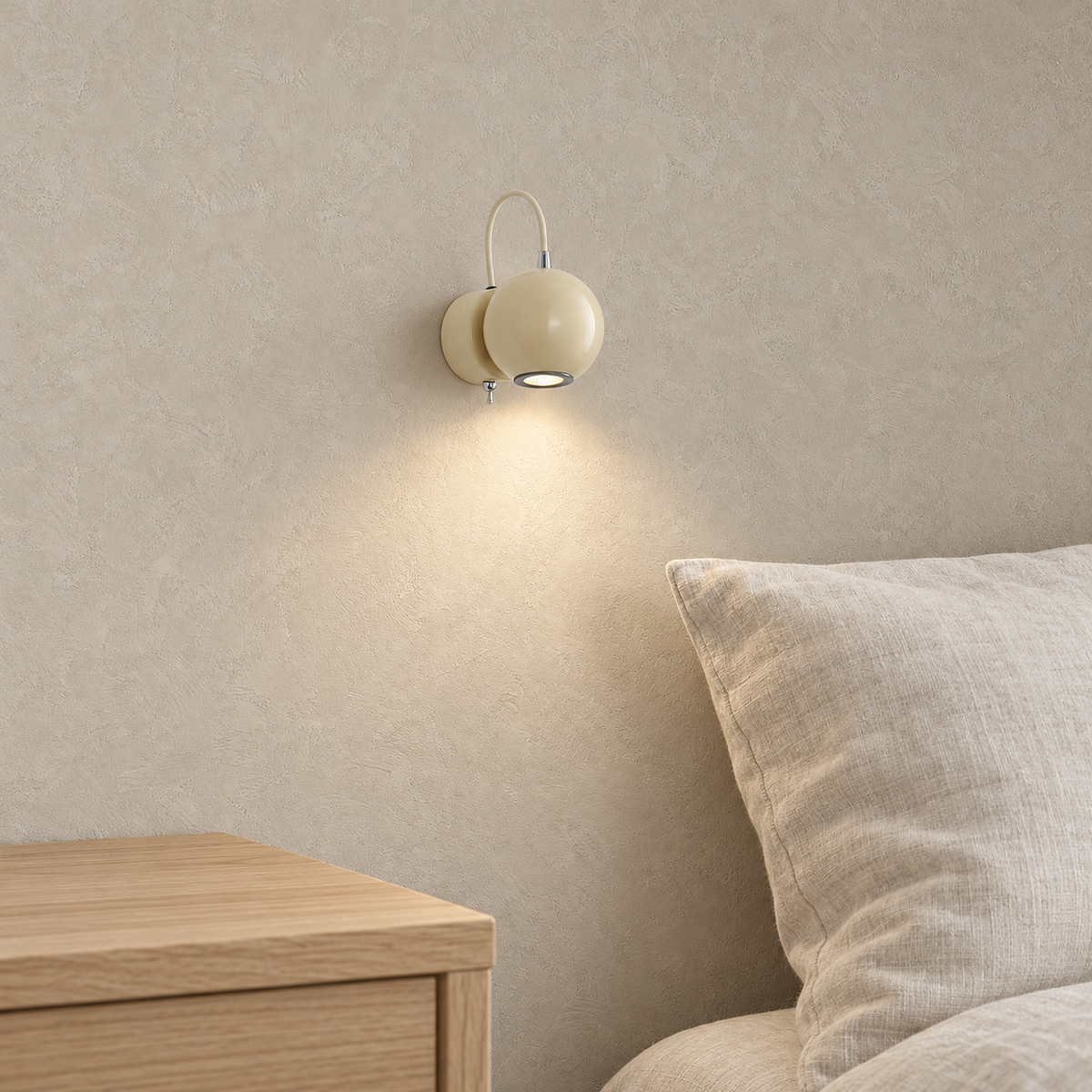 Lirema off white bedside wall light shining warm beside an ivory pillow in daylight #color_off white
