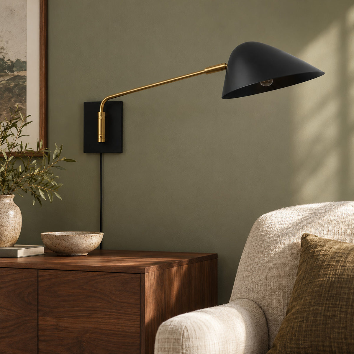 Lirmena black plug in version led wall sconce with its power cord running down the wall to the outlet
