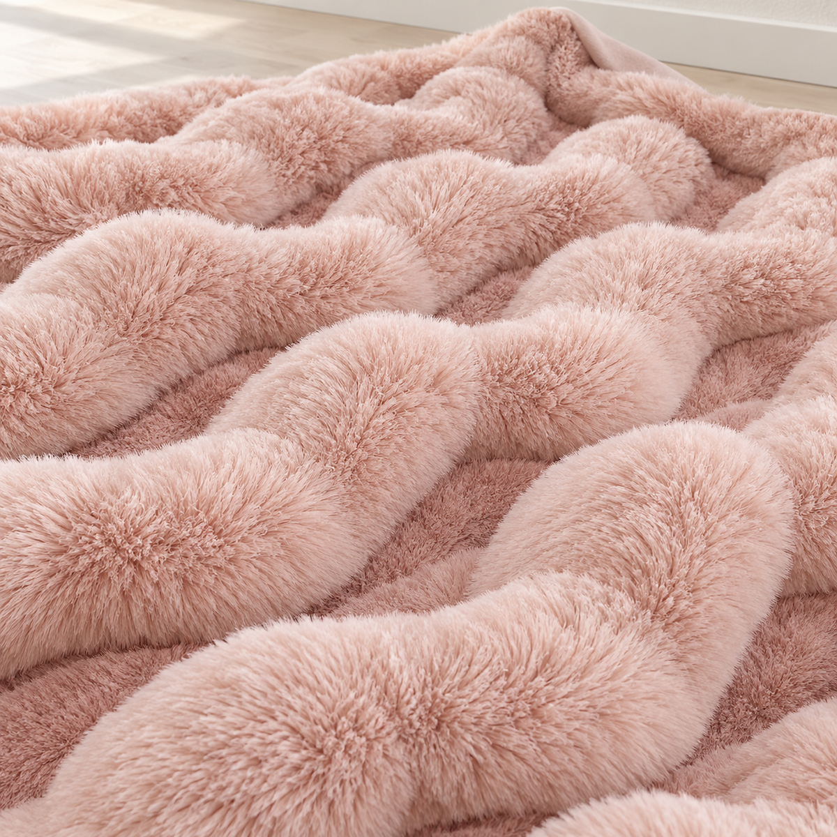 Lomarsi rose blush faux fur throw blanket up close, showing raised rows and recessed channels