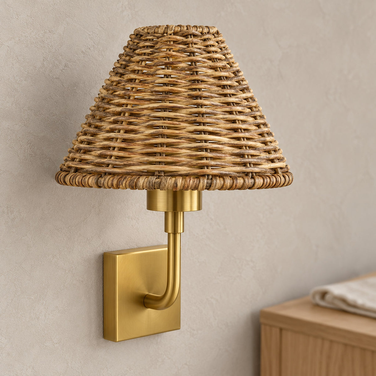 Lomarvi gold wall sconce close up showing the natural bamboo and rattan weave of its shade