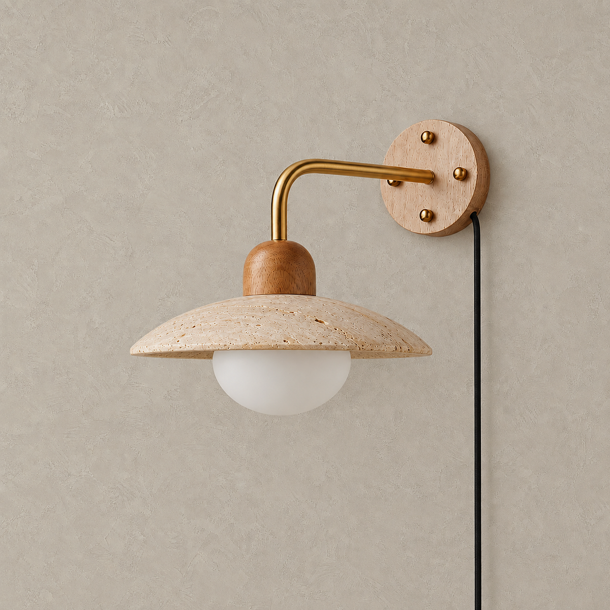 Lomiseta gold and yellow travertine plug in wall sconce unlit against greige plaster