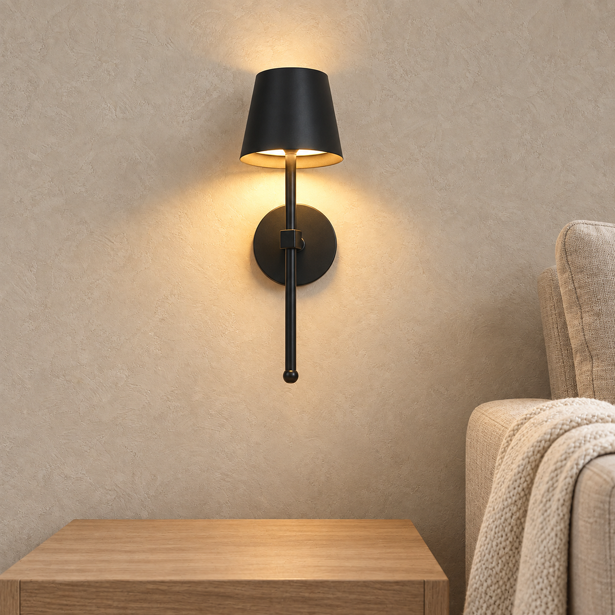 Loranno black battery operated wall sconce lighting a clear side table in a bright living room