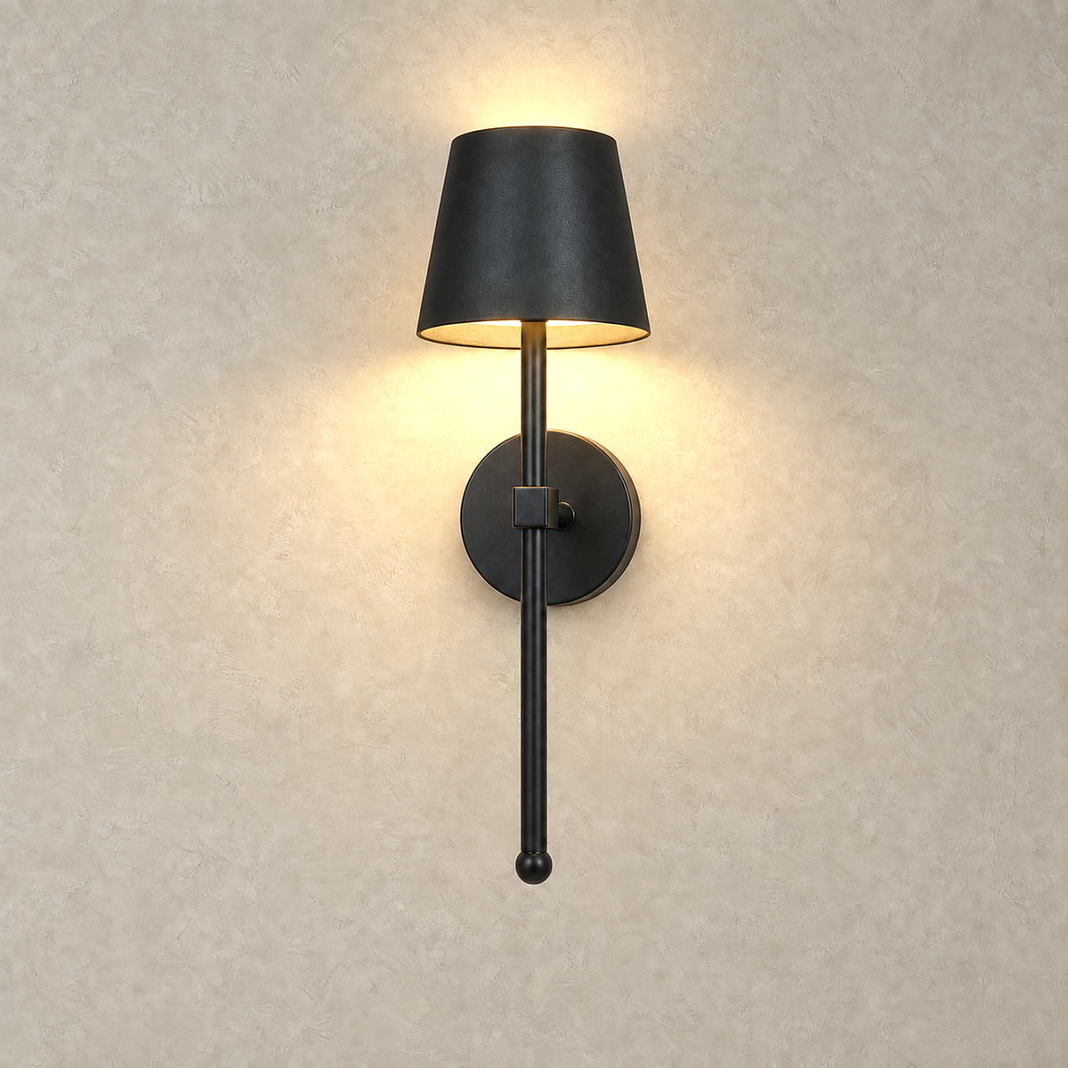 Loranno black bedside lamp switched on and glowing on a plaster wall