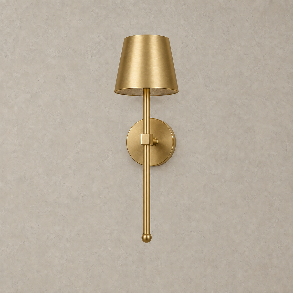 Loranno gold LED wall sconce unlit against the warm greige plaster backdrop #color_gold