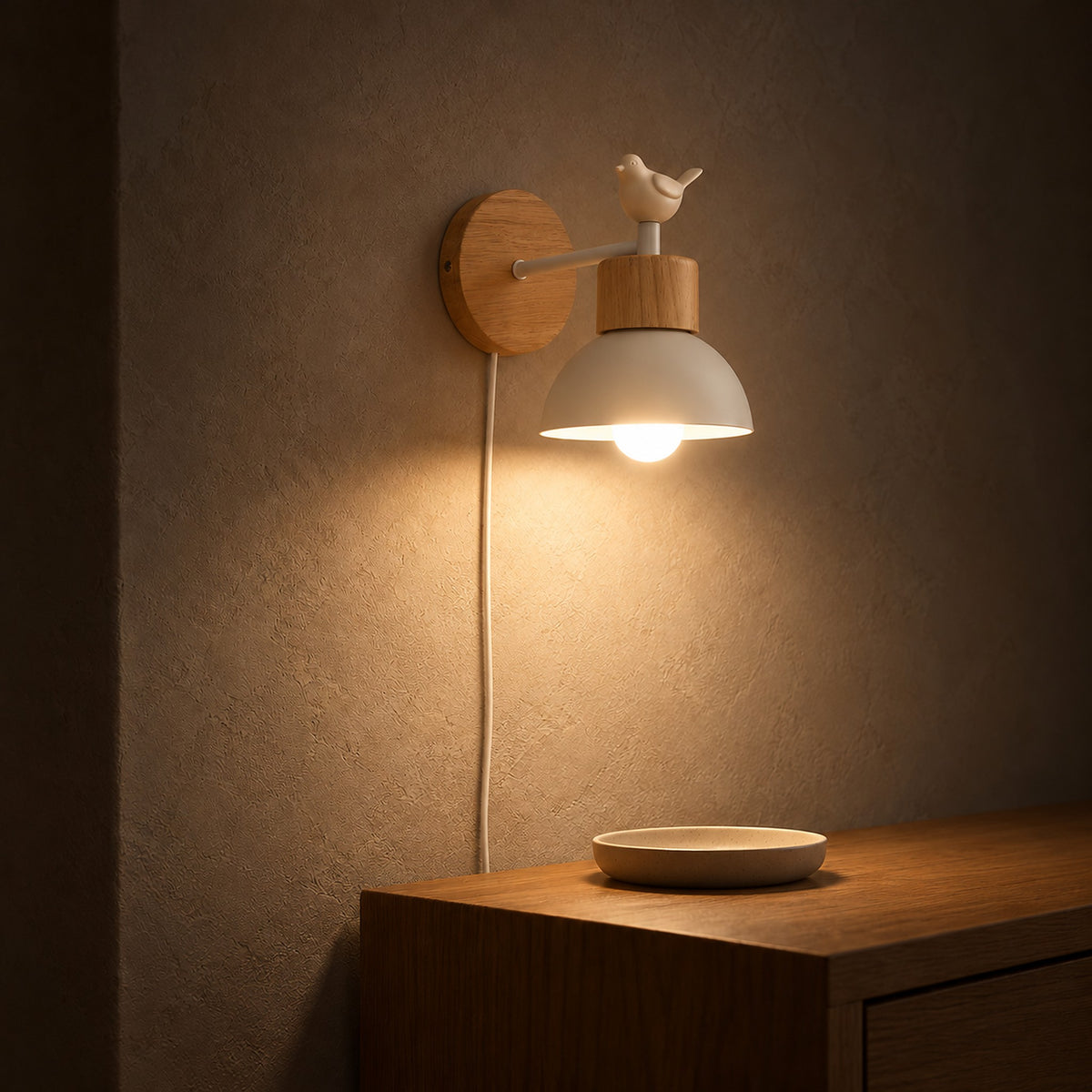 Lorsenta white wall lamp casting light onto an entryway dish at night