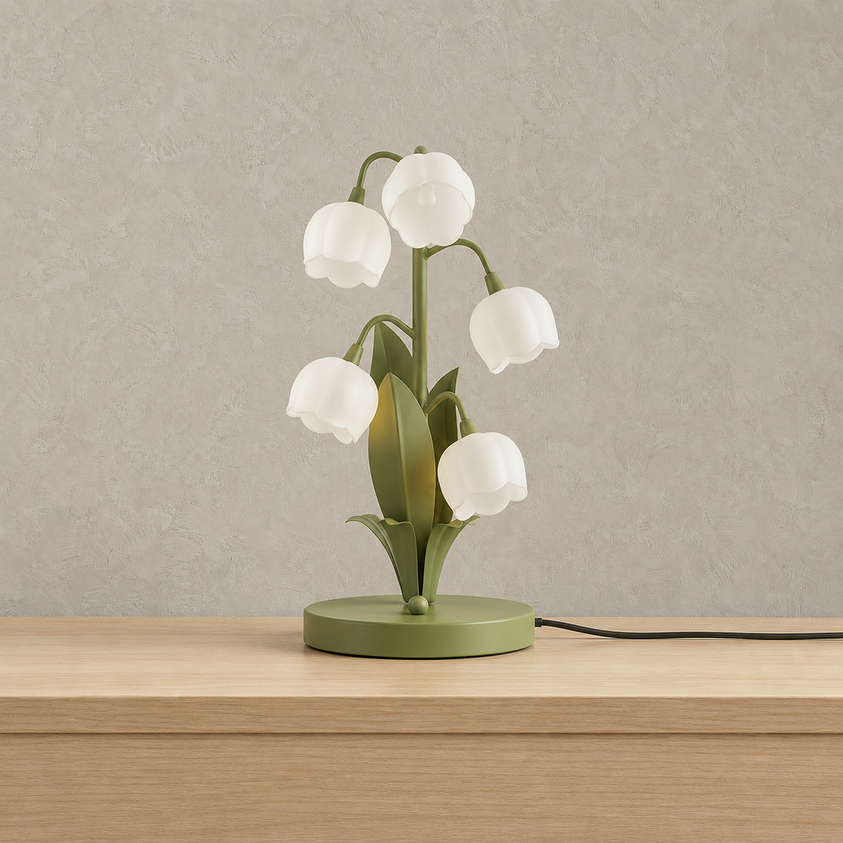 Marosine floral table lamp with white flower shades on a green body switched off on a plain backdrop