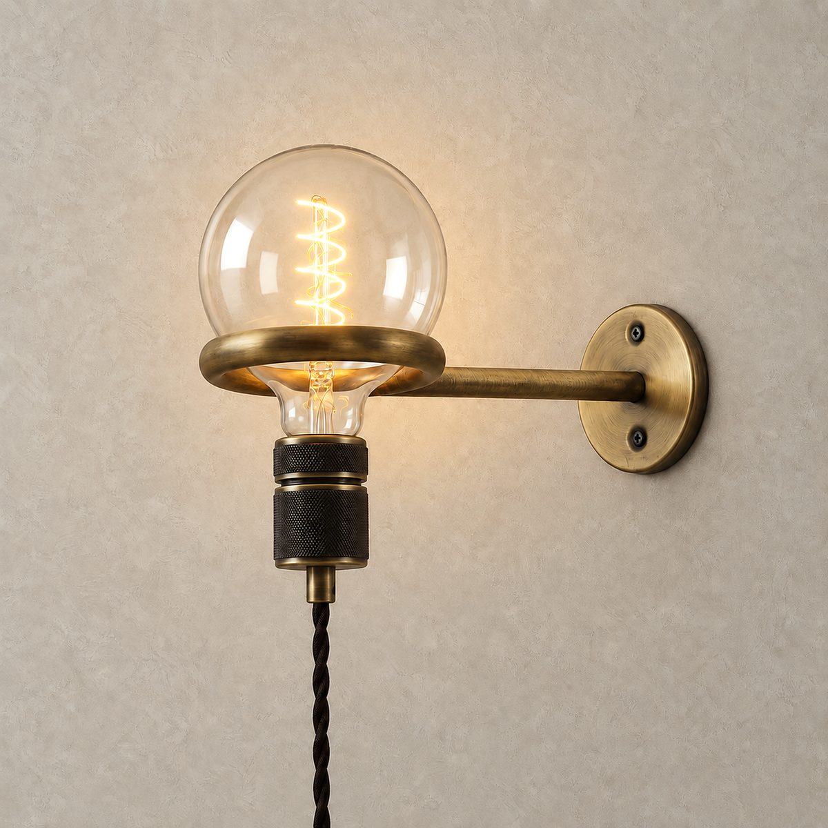 Masirel brown cable wall light lit against greige plaster with its single bulb glowing