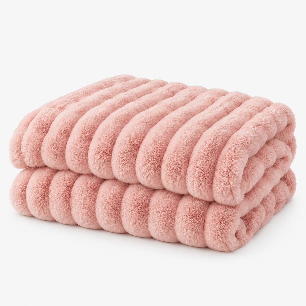 Mavilore coral fleece blanket in pink, loosely folded on a plain white background