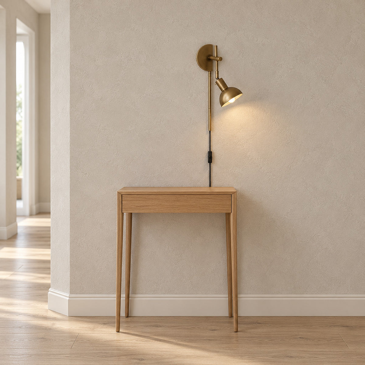 Melcasi plug in led wall sconce with antique brass colored shade in a hallway with its cord and switch in view