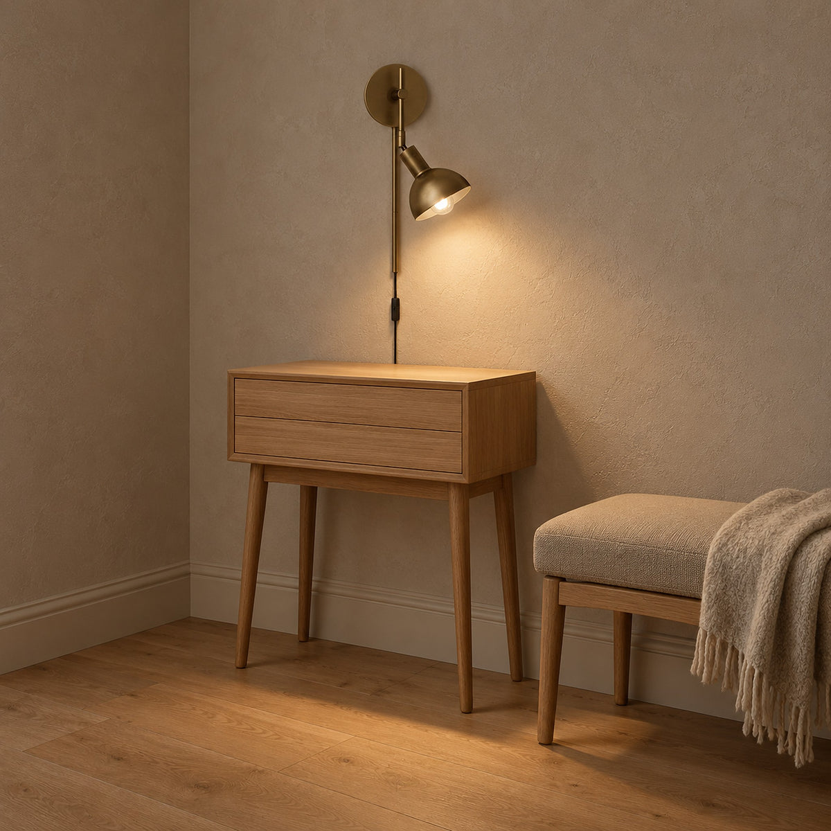 Melcasi led wall sconce with antique brass colored shade glowing over a clear console in a hallway