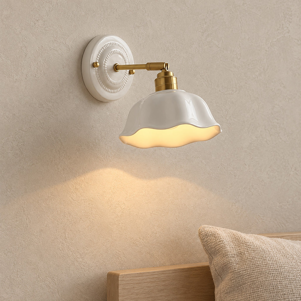 Melorvi white bedside wall light glowing beside a pillow in a guest sleeping alcove