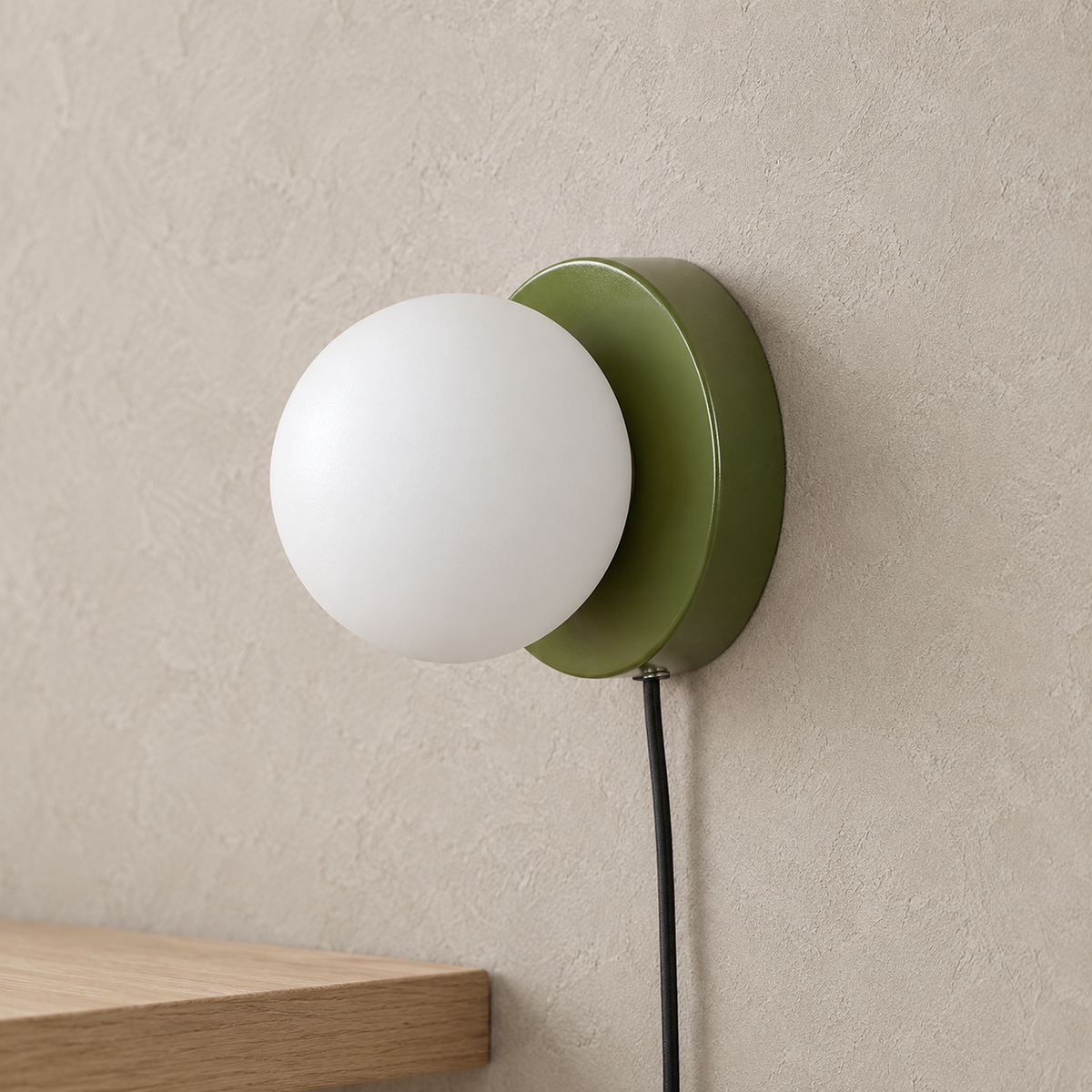 Memilora green plug in wall light close up on the globe and its shallow round base