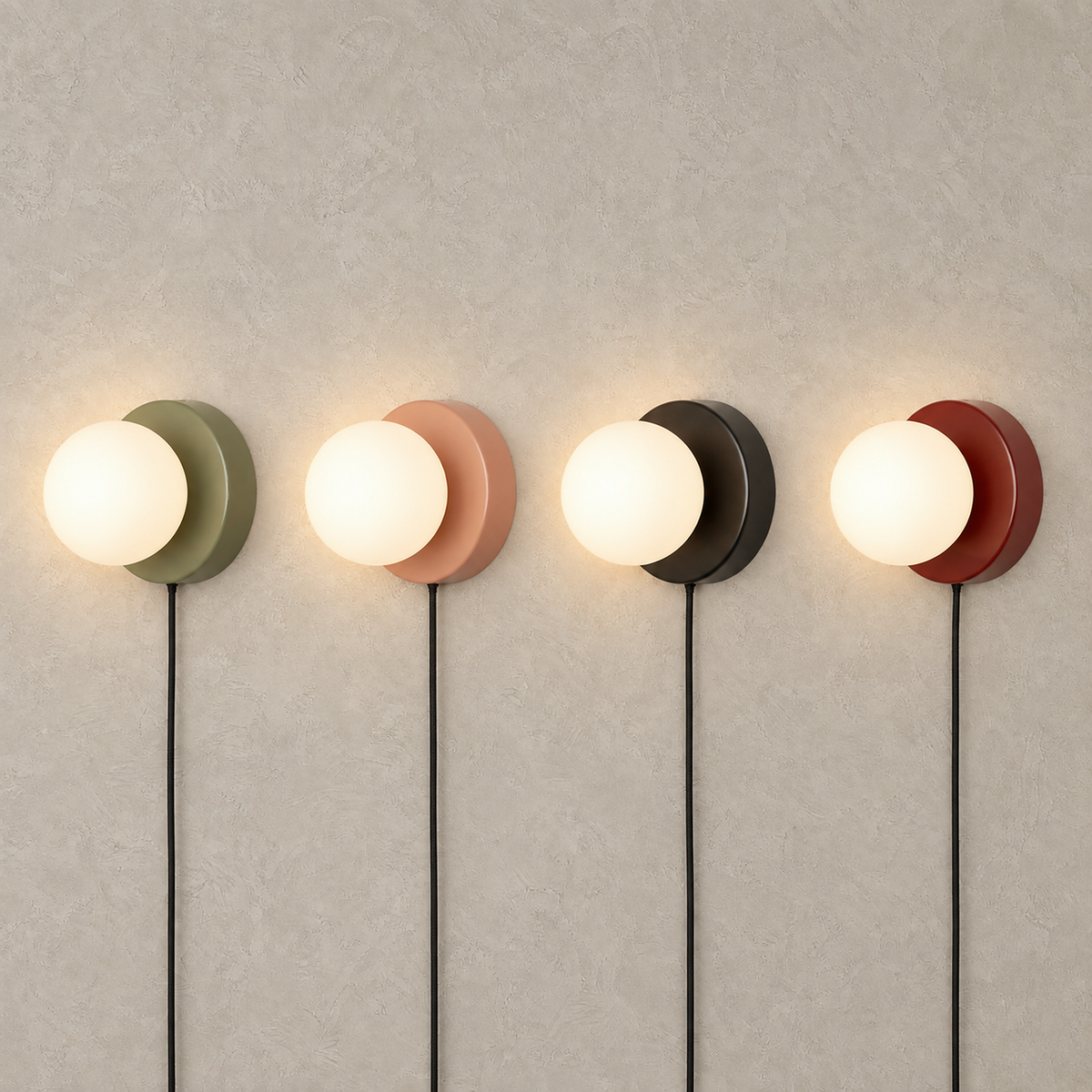 Memilora green, shrimp pink, black and red plug in wall sconce globes glowing together