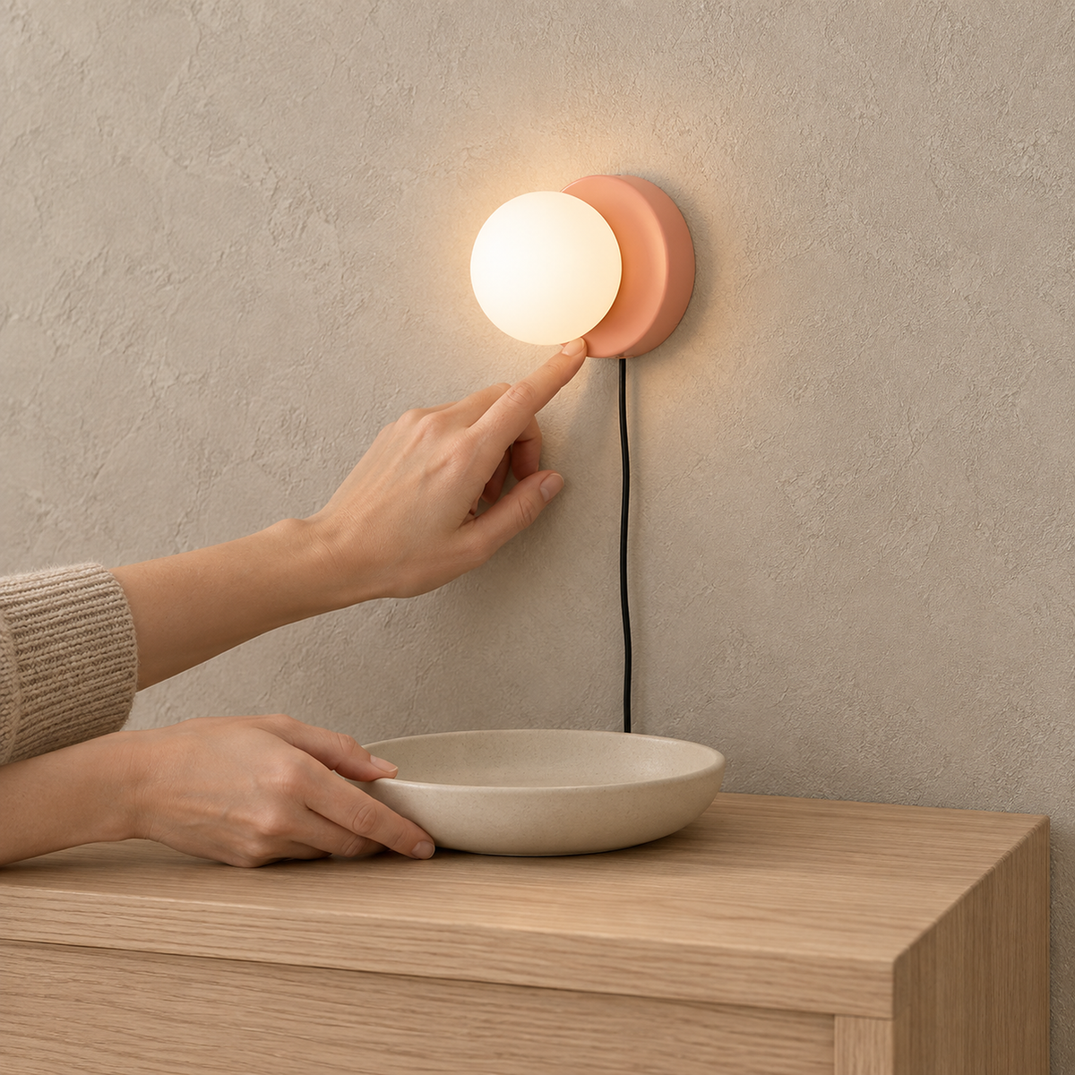 Memilora shrimp pink plug in wall lamp glowing above an entryway console #color_shrimp pink