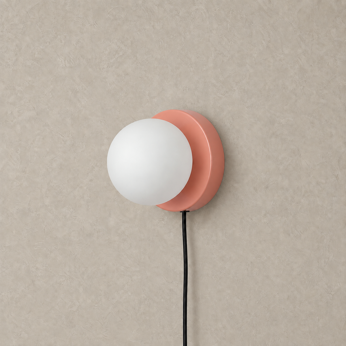 Memilora shrimp pink plug in wall light unlit, white globe on its round colored disc #color_shrimp pink