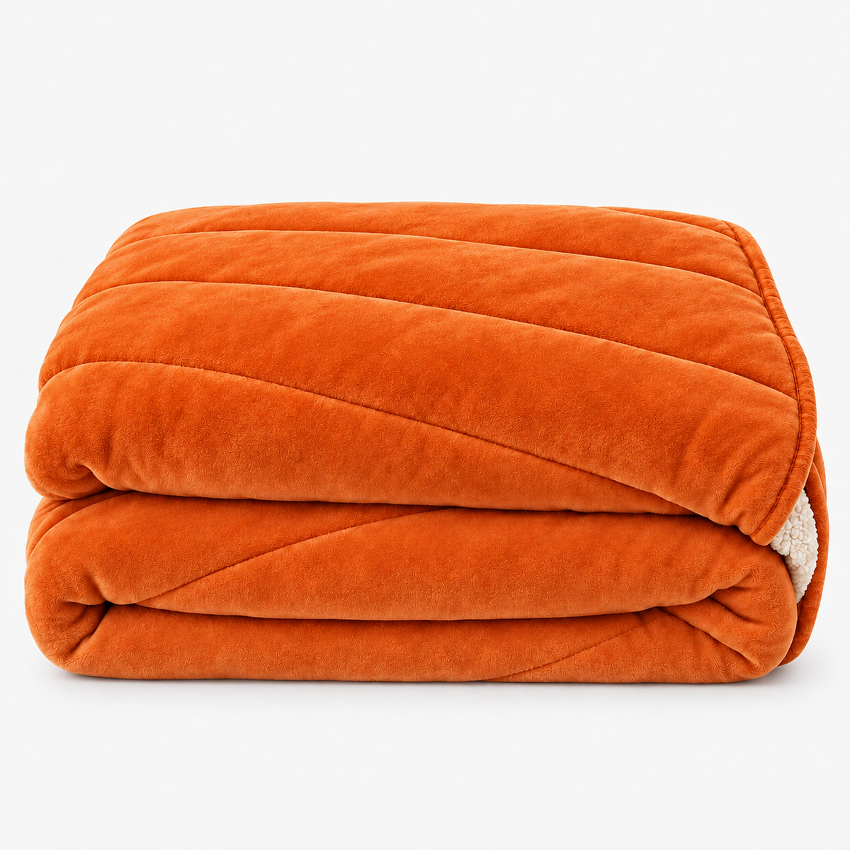 Merivola orange sherpa fleece blanket loosely folded on its own against a plain backdrop #color_orange