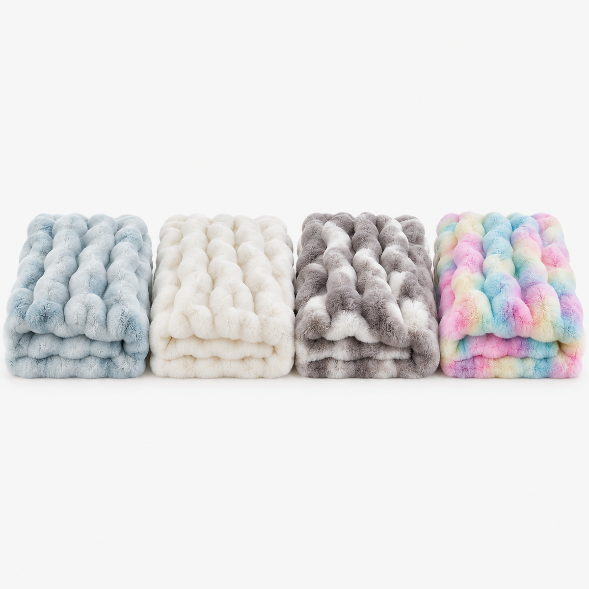 Mevorina faux fur throw blanket in tie dye blue, cream white, gray and tie dye rainbow folded side by side