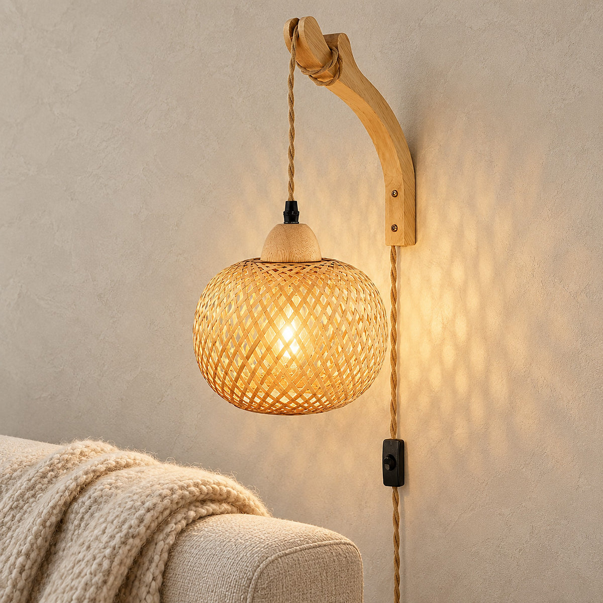 Milsoren bamboo wall lamp glowing beside an oatmeal chair in a daytime reading corner