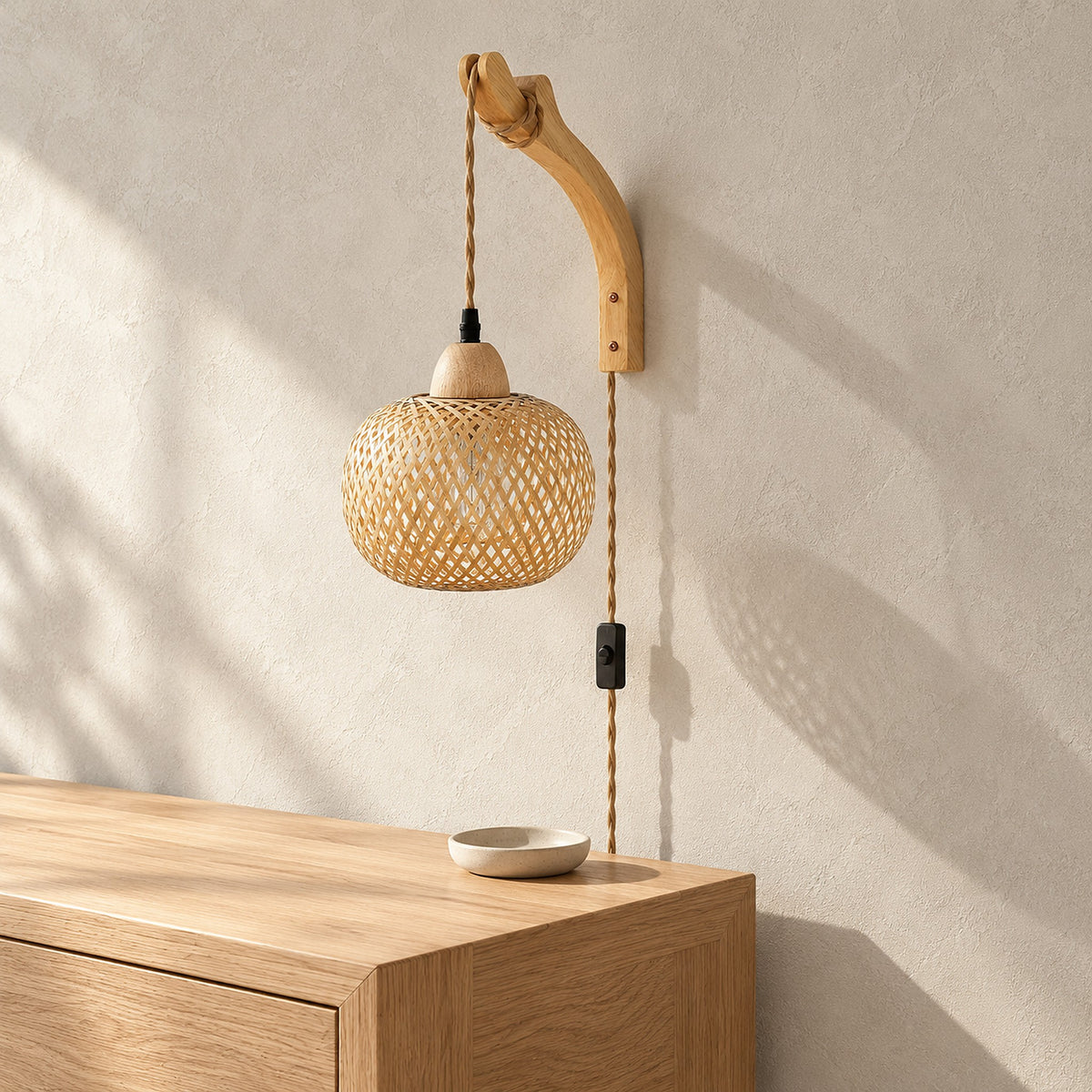 Milsoren bamboo wall sconce, unlit, hanging in a bright sunny entryway by day